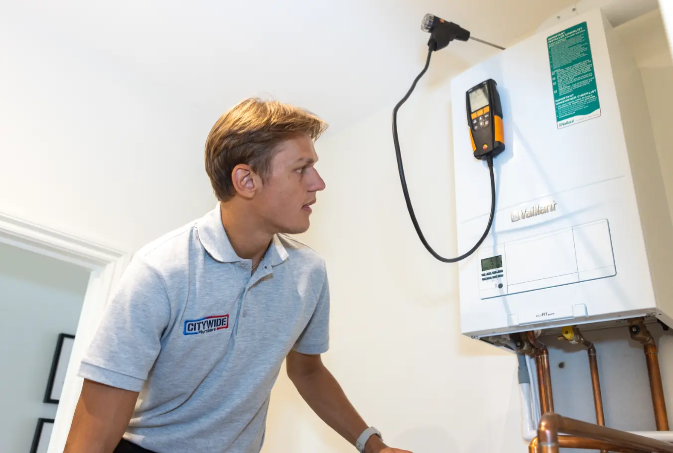 Citywide Plumbers engineer working on a boiler