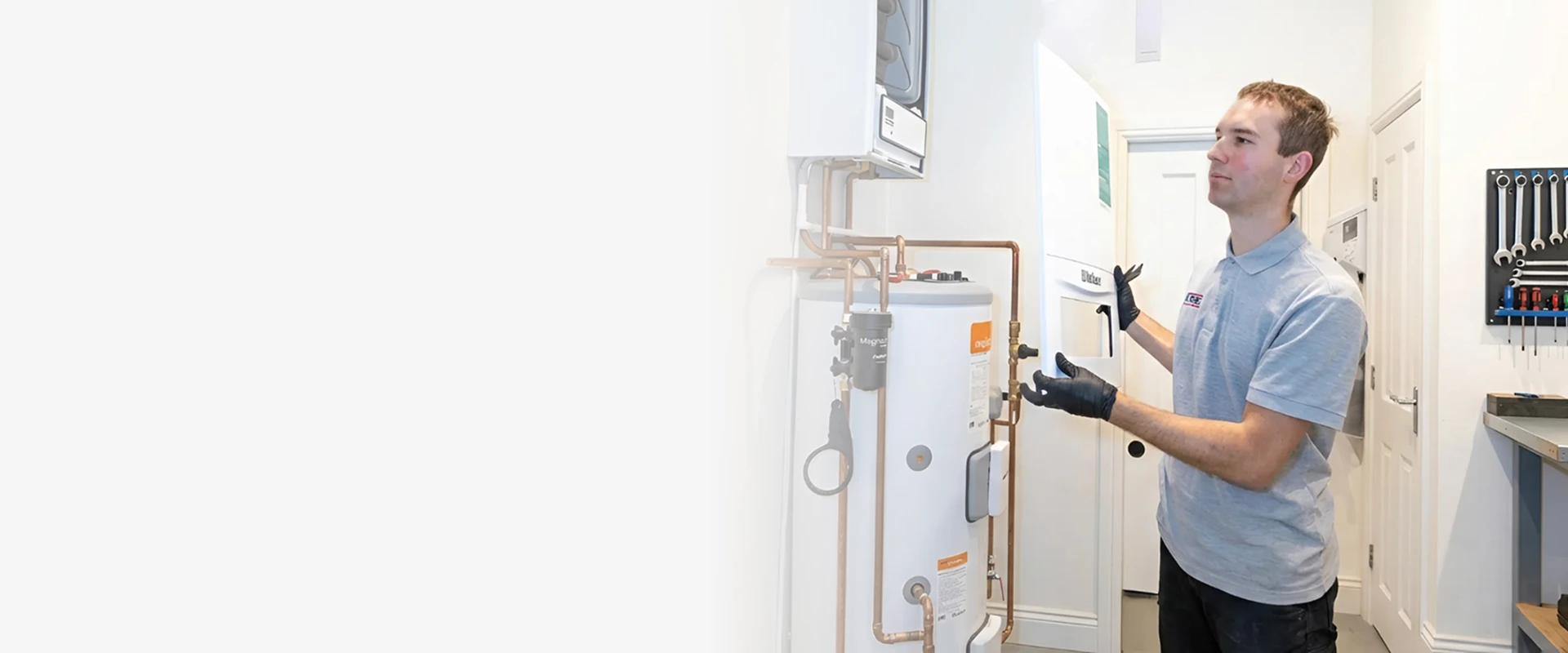 Engineer carrying out a boiler repair in West London
