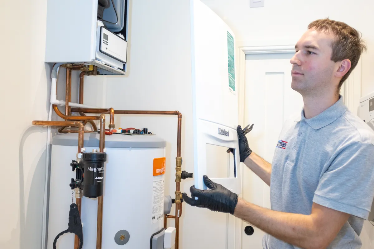 Engineer carrying out a boiler repair in West London