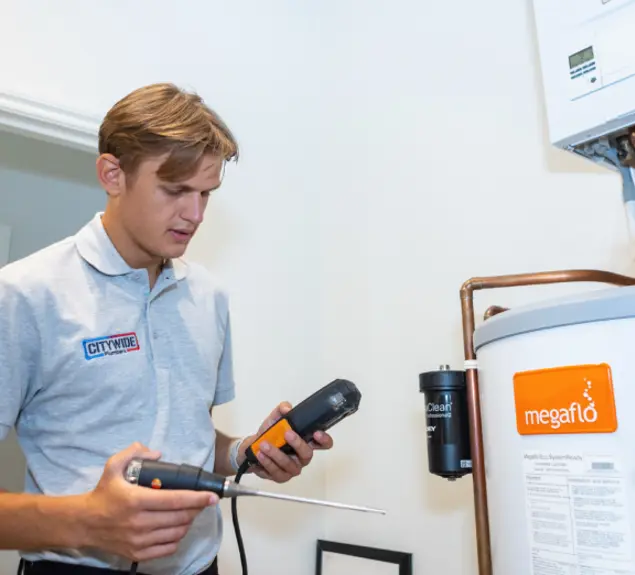 Citywide Plumbers engineer checking a boiler system